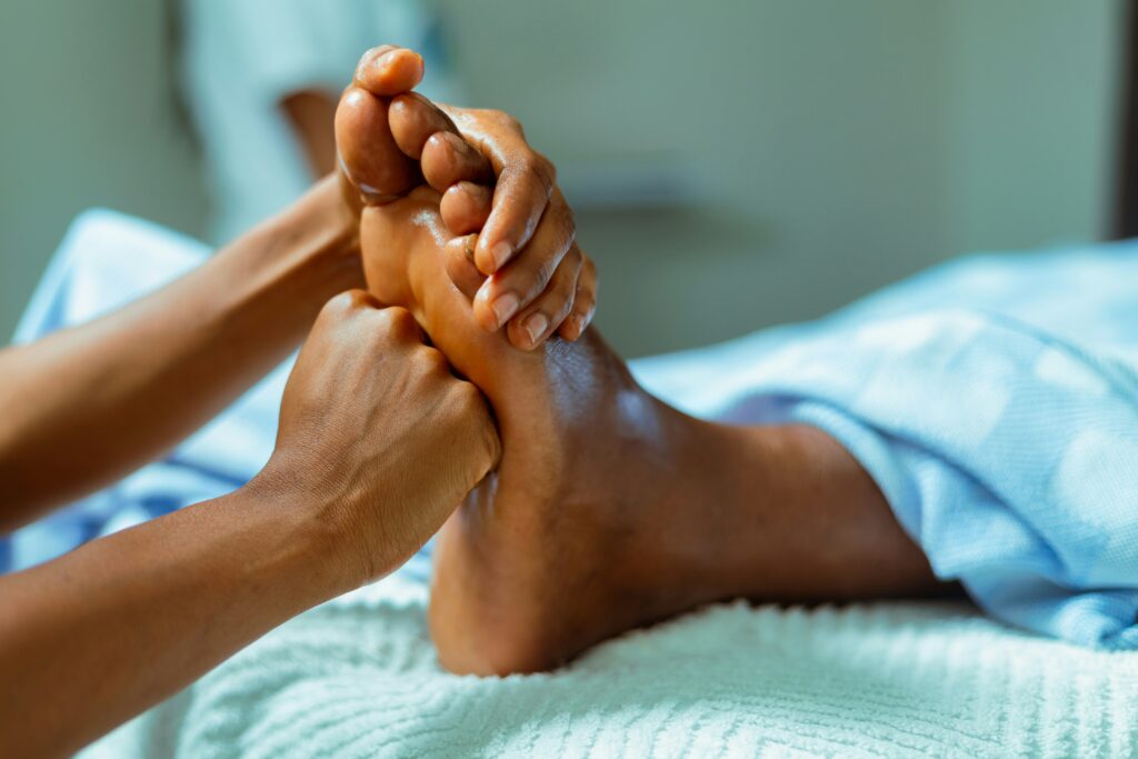 Oiled foot reflexology with pressure point technique at Li's Spa Redmond