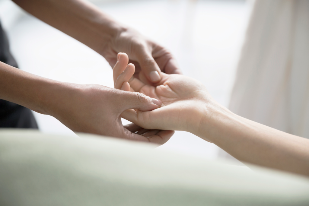 Hand reflexology with palm pressure points at Li's Spa Redmond