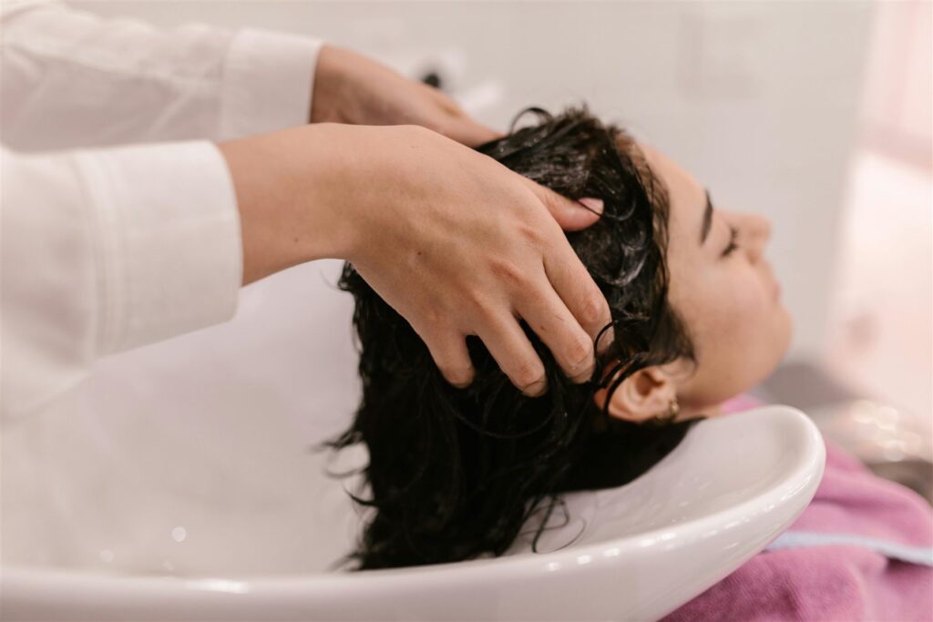 Scalp massage in a shampoo bowl at Li's Spa Redmond