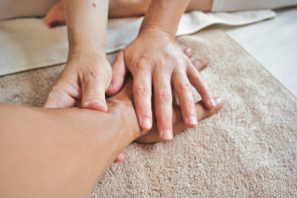 Sports massage with deep forearm friction technique at Li's Spa Redmond