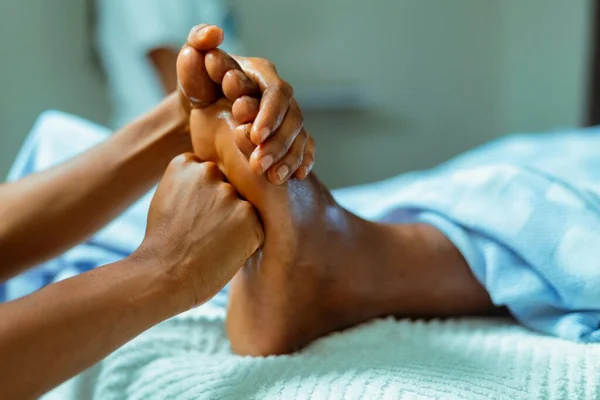 Oiled foot reflexology with pressure point technique at Li's Spa Redmond